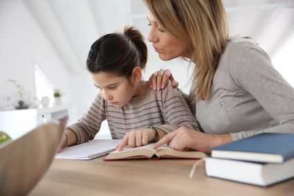 Mom helping kid with homework